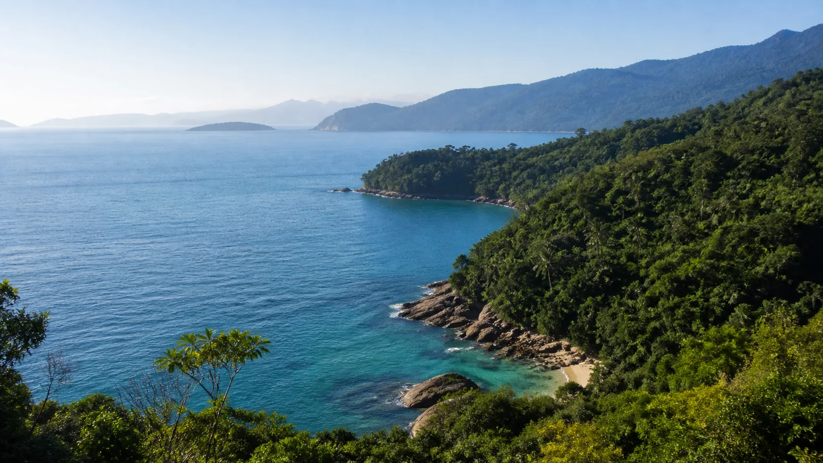 Ilhabela coastline with Atlantic rainforest and a quiet cove in São Paulo, Brazil