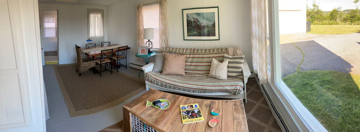 Eating and sitting area. Huge new window allows unobstructed sunset views. at Lubec Saltbox in Lubec
