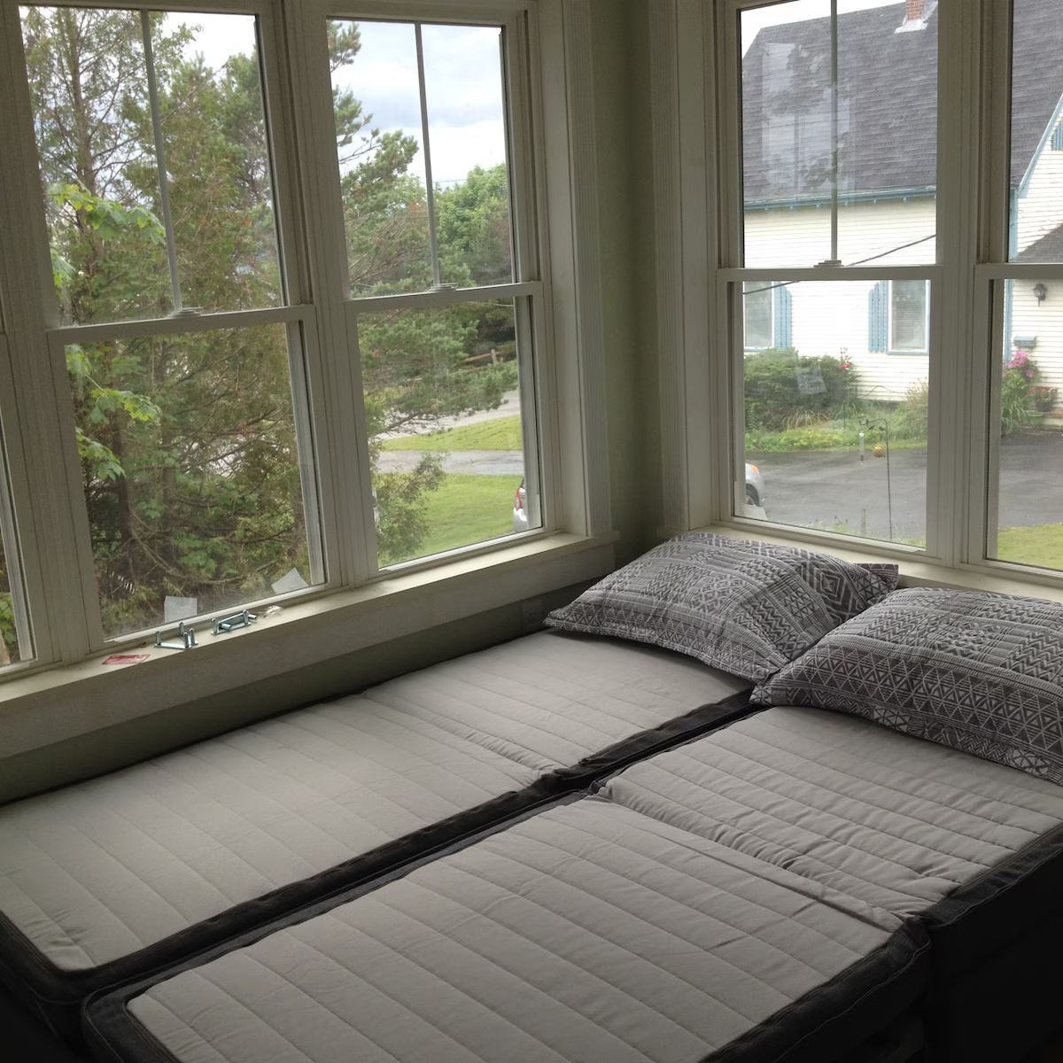The window seat converts in a trice to a queen sized bed (or two narrow singles) - very comfy! at Horror Hill Cottage in Lubec