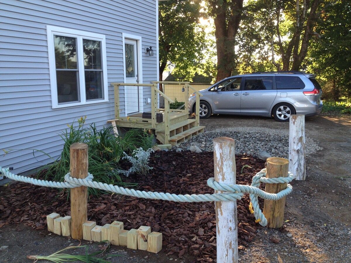 We're working on landscaping. The day lilies were split from a neighbors yard and the rope washed up on the beach. at Horror Hill Cottage in Lubec