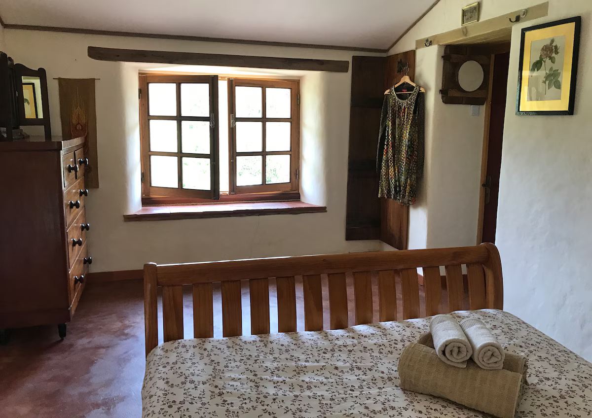Bedroom with view to terrace at Quinta Tranquila in Odeceixe